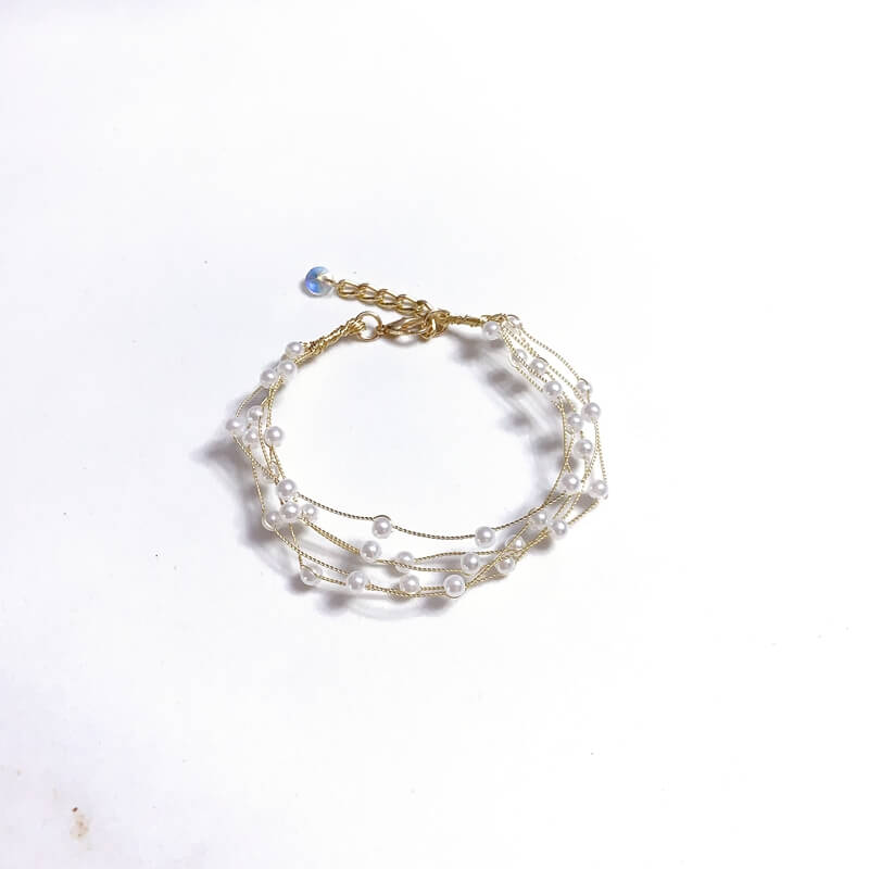 Pulsera de bronce con perla